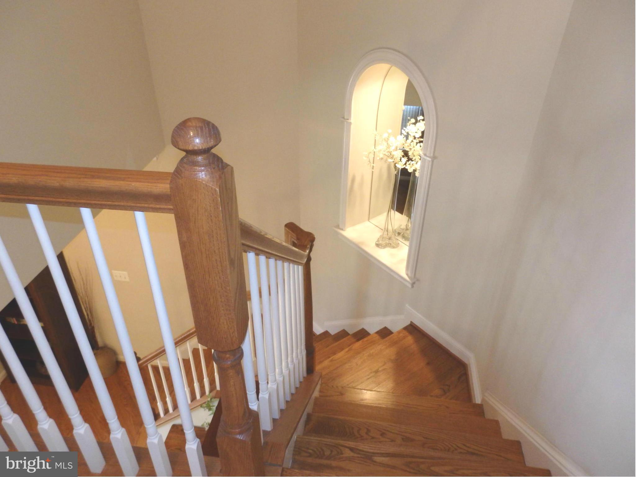 2634 Mill Race Road Frederick, MD 21701 - Photo 10 of 30 Hardwood stairs and lighted mirror niche in foyer