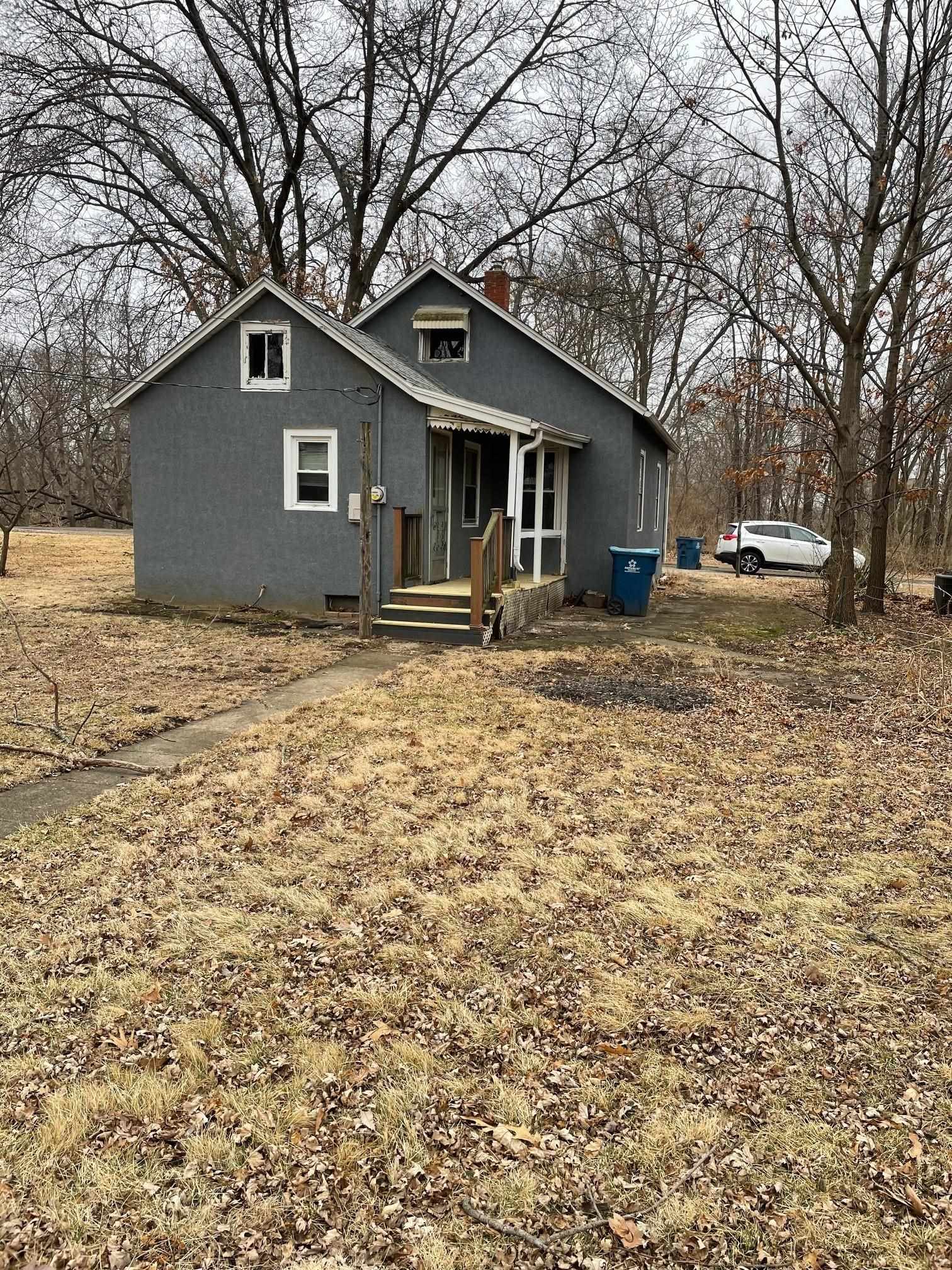 106 Ravine Street Spring Valley, IL 61362 - Photo 2 of 7 a house with trees in the background