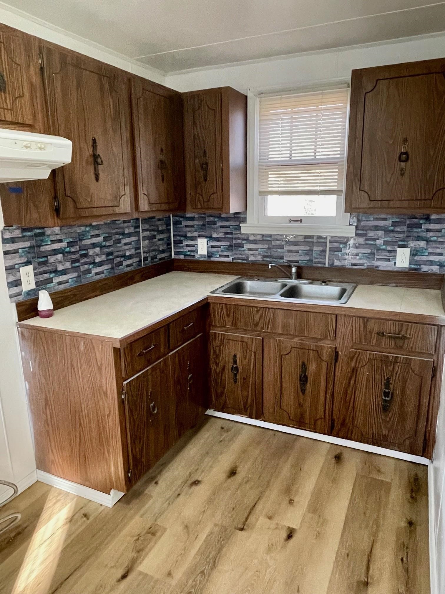 106 Ravine Street Spring Valley, IL 61362 - Photo 5 of 7 a kitchen with stainless steel appliances granite countertop a sink and a stove