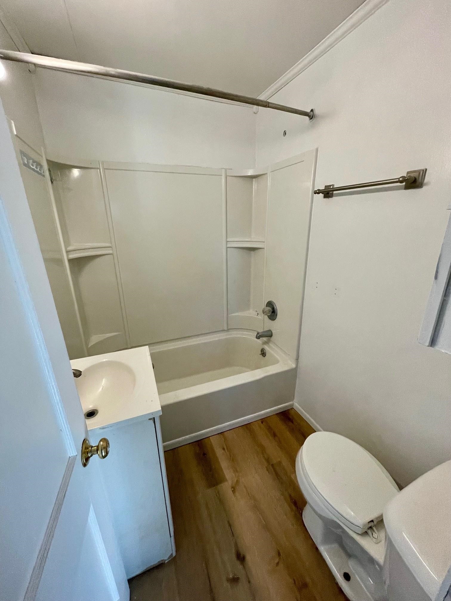 106 Ravine Street Spring Valley, IL 61362 - Photo 6 of 7 a bathroom with a sink a toilet and shower