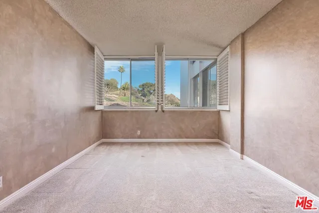 a bathroom with a sink a mirror and shower