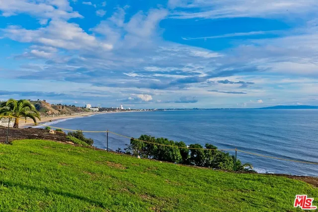 a view of a street with an ocean view