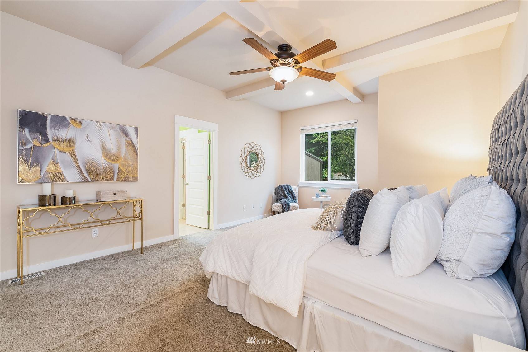 3710 222nd Place Southeast Bothell, WA 98021 - Photo 11 of 37 a bedroom with a large bed and a chandelier