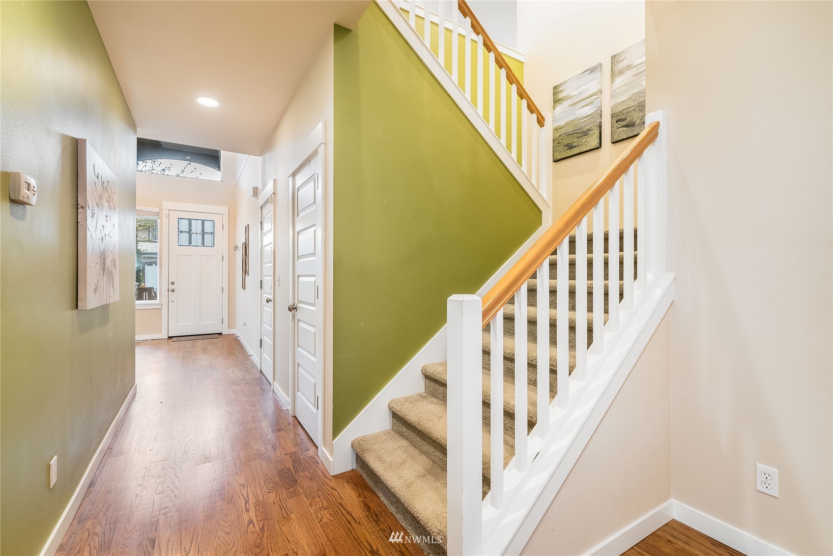 3710 222nd Place Southeast Bothell, WA 98021 - Photo 16 of 37 a view of a hallway with wooden floor and staircase