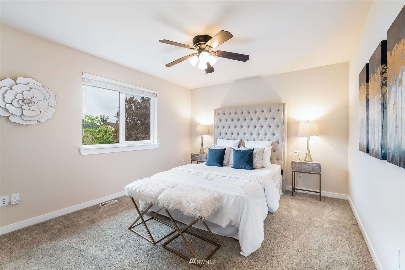 3710 222nd Place Southeast Bothell, WA 98021 - Photo 27 of 37 a bedroom with a bed and a chandelier