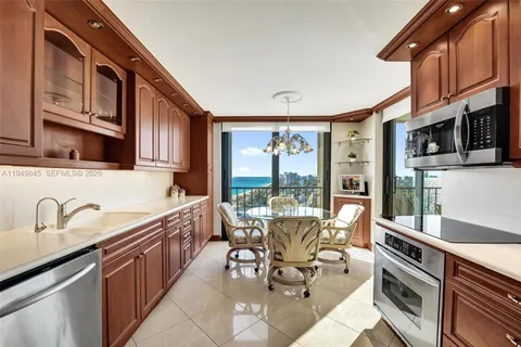a kitchen with stainless steel appliances granite countertop a sink and cabinets