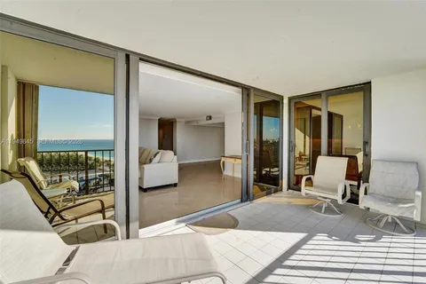 a bedroom with a bed and glass door