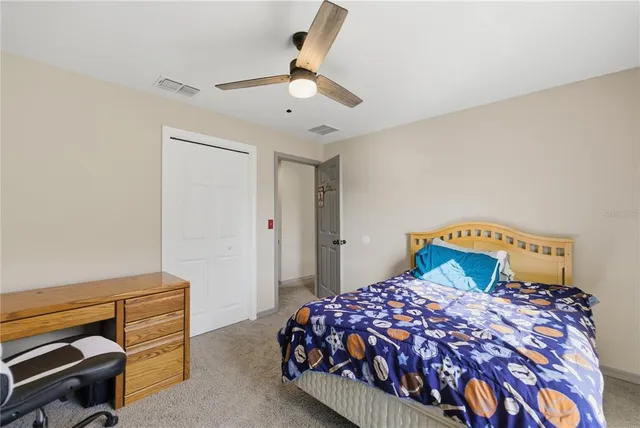 a bedroom with a bed and a dresser