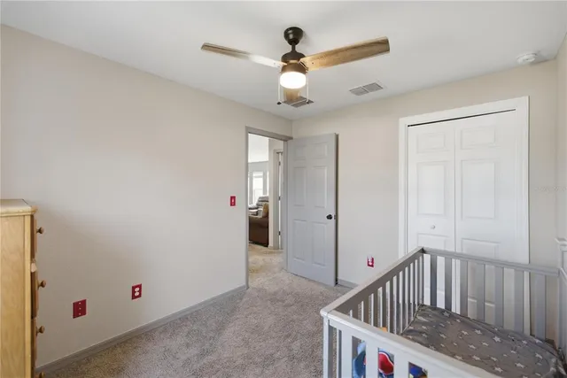 a view of a bedroom with furniture and natural light