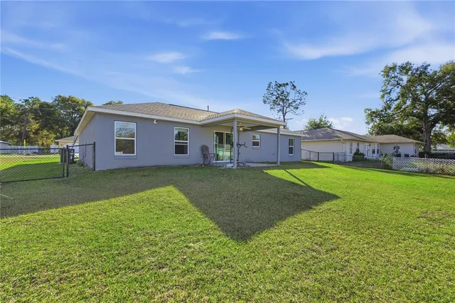 a view of a house with a big yard