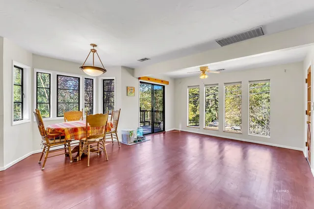 a bathroom with a sink and a large window