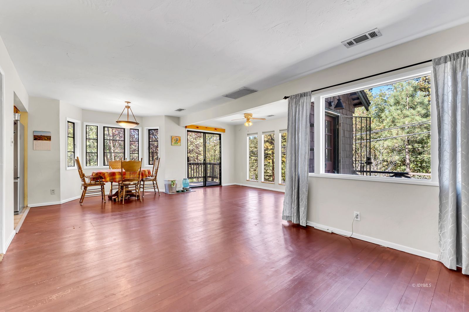53575 Tollgate Road Idyllwild, CA 92549 - Photo 30 of 71 a view of dining room with furniture and floor to ceiling window