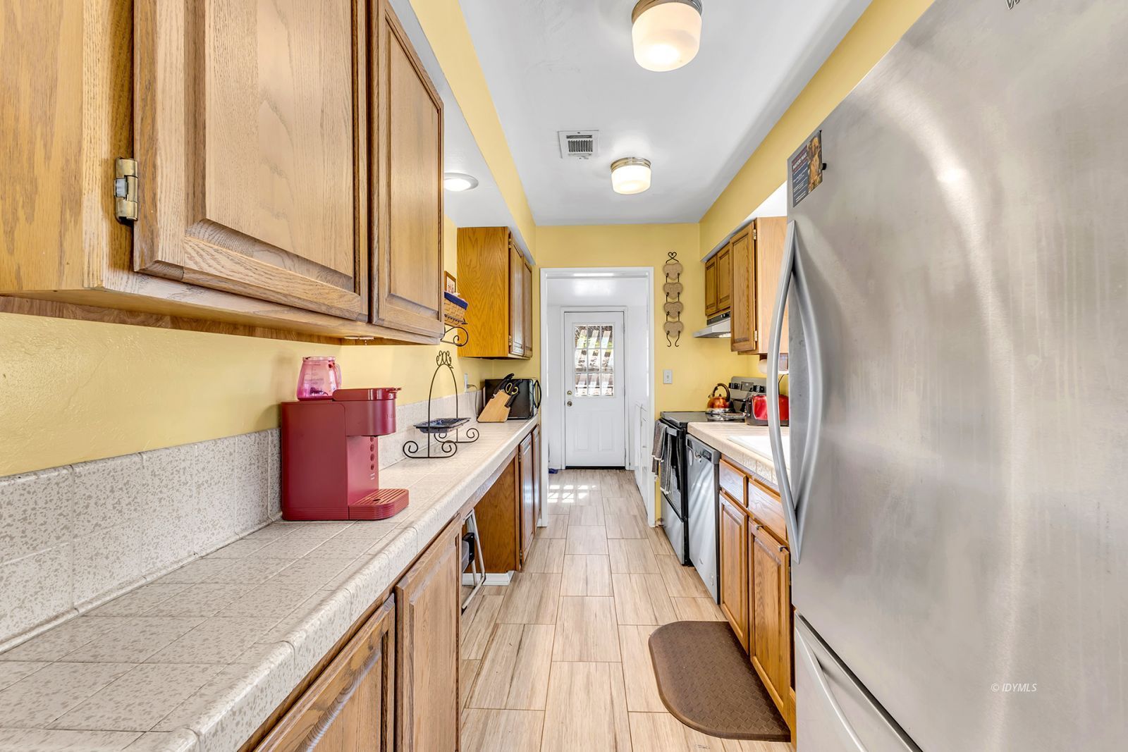 53575 Tollgate Road Idyllwild, CA 92549 - Photo 31 of 71 a kitchen with stainless steel appliances granite countertop a sink and cabinets