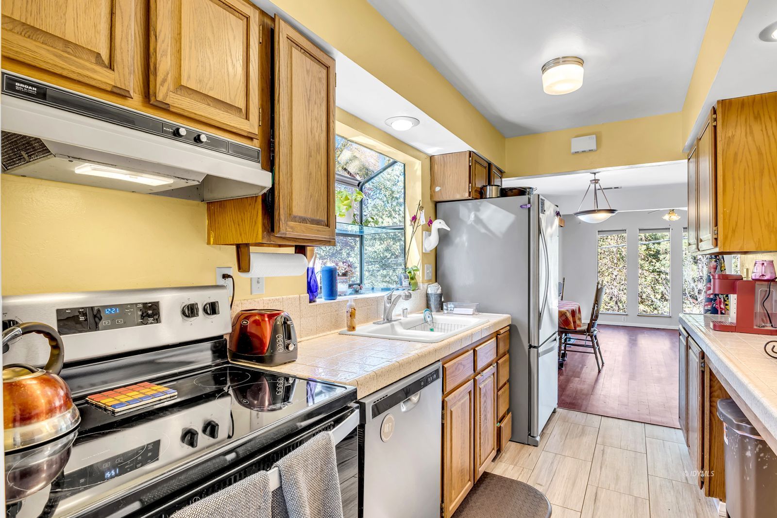 53575 Tollgate Road Idyllwild, CA 92549 - Photo 36 of 71 a kitchen with stainless steel appliances granite countertop a sink stove and refrigerator