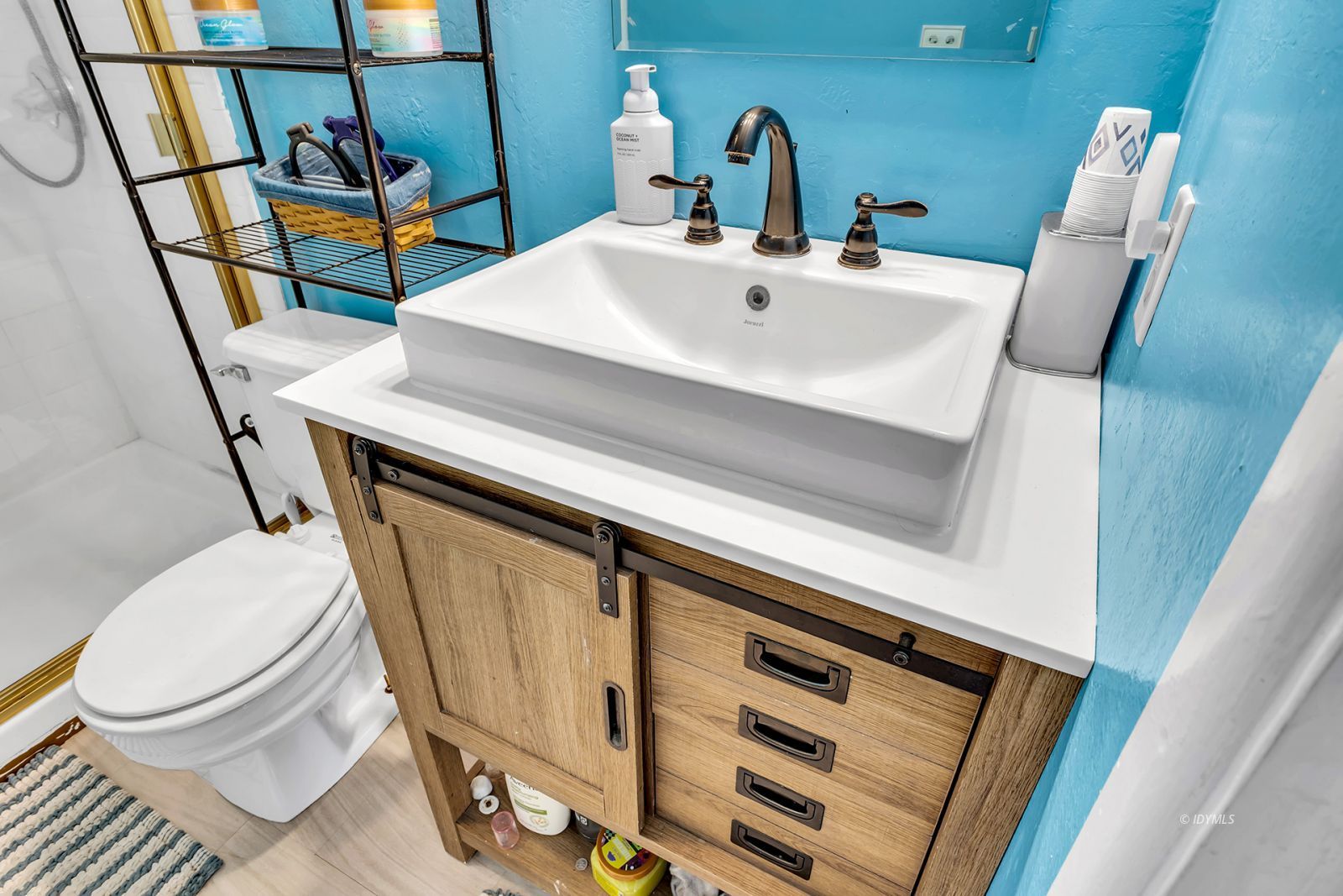 53575 Tollgate Road Idyllwild, CA 92549 - Photo 40 of 71 a bathroom with a sink a toilet and mirror