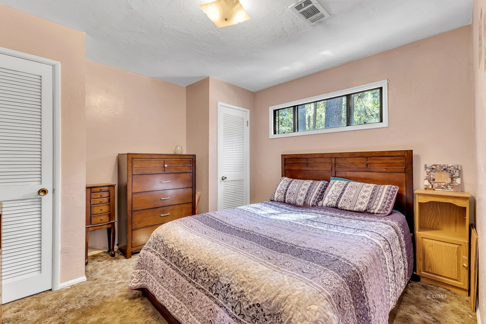 53575 Tollgate Road Idyllwild, CA 92549 - Photo 41 of 71 a bedroom with a bed and dresser