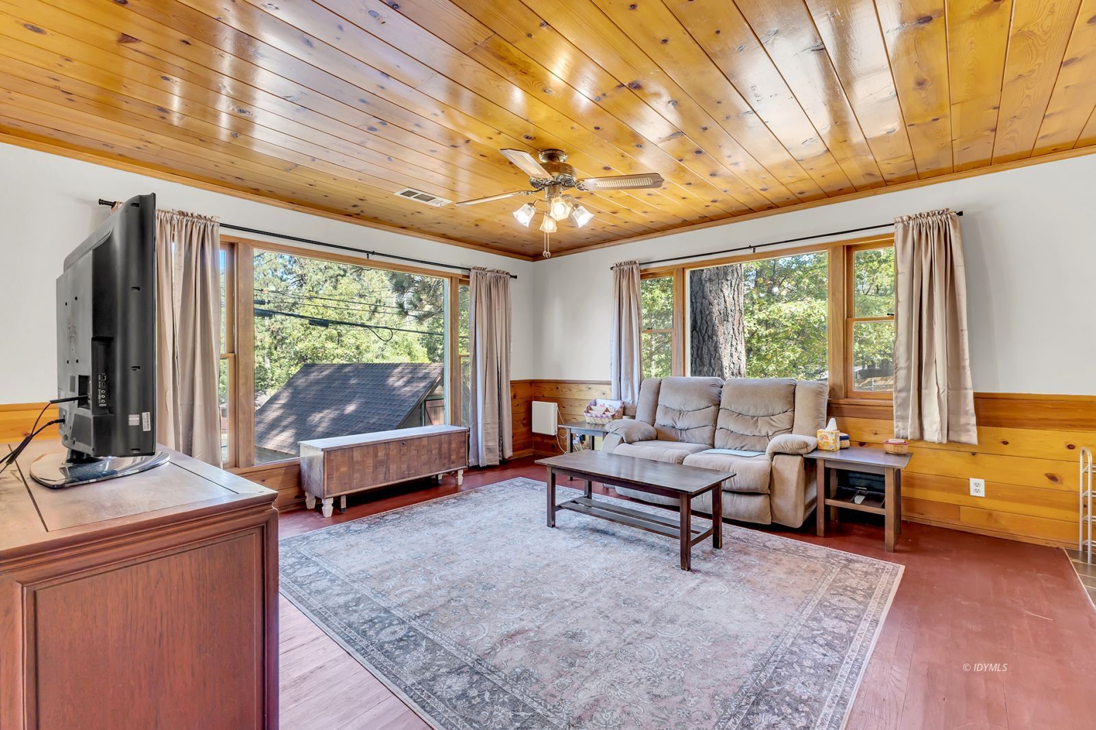 53575 Tollgate Road Idyllwild, CA 92549 - Photo 42 of 71 a living room with furniture and a large window