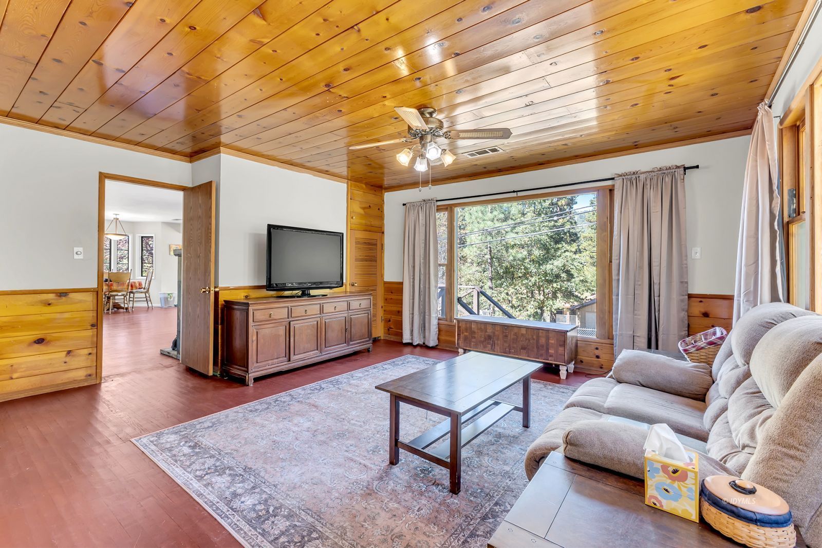 53575 Tollgate Road Idyllwild, CA 92549 - Photo 43 of 71 a living room with furniture and a flat screen tv