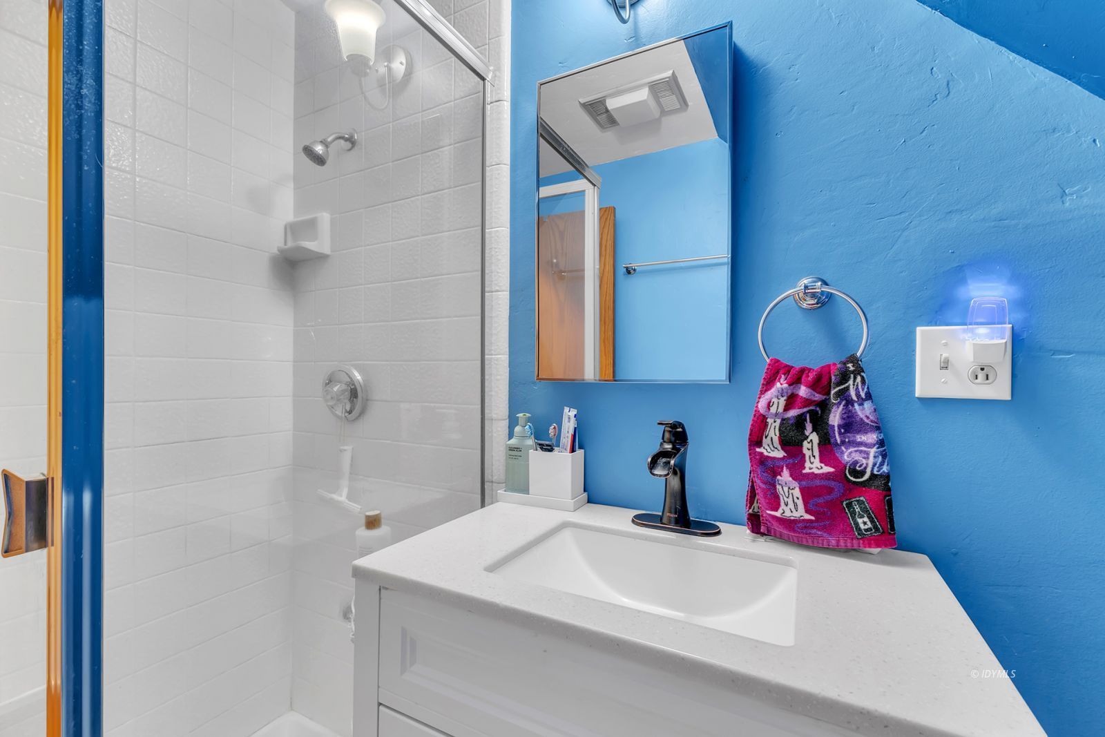 53575 Tollgate Road Idyllwild, CA 92549 - Photo 56 of 71 a bathroom with a sink vanity and a shower