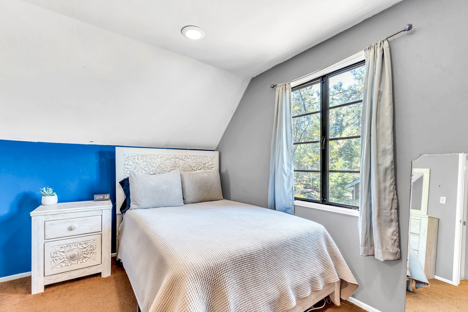 53575 Tollgate Road Idyllwild, CA 92549 - Photo 57 of 71 a bedroom with a bed and a window