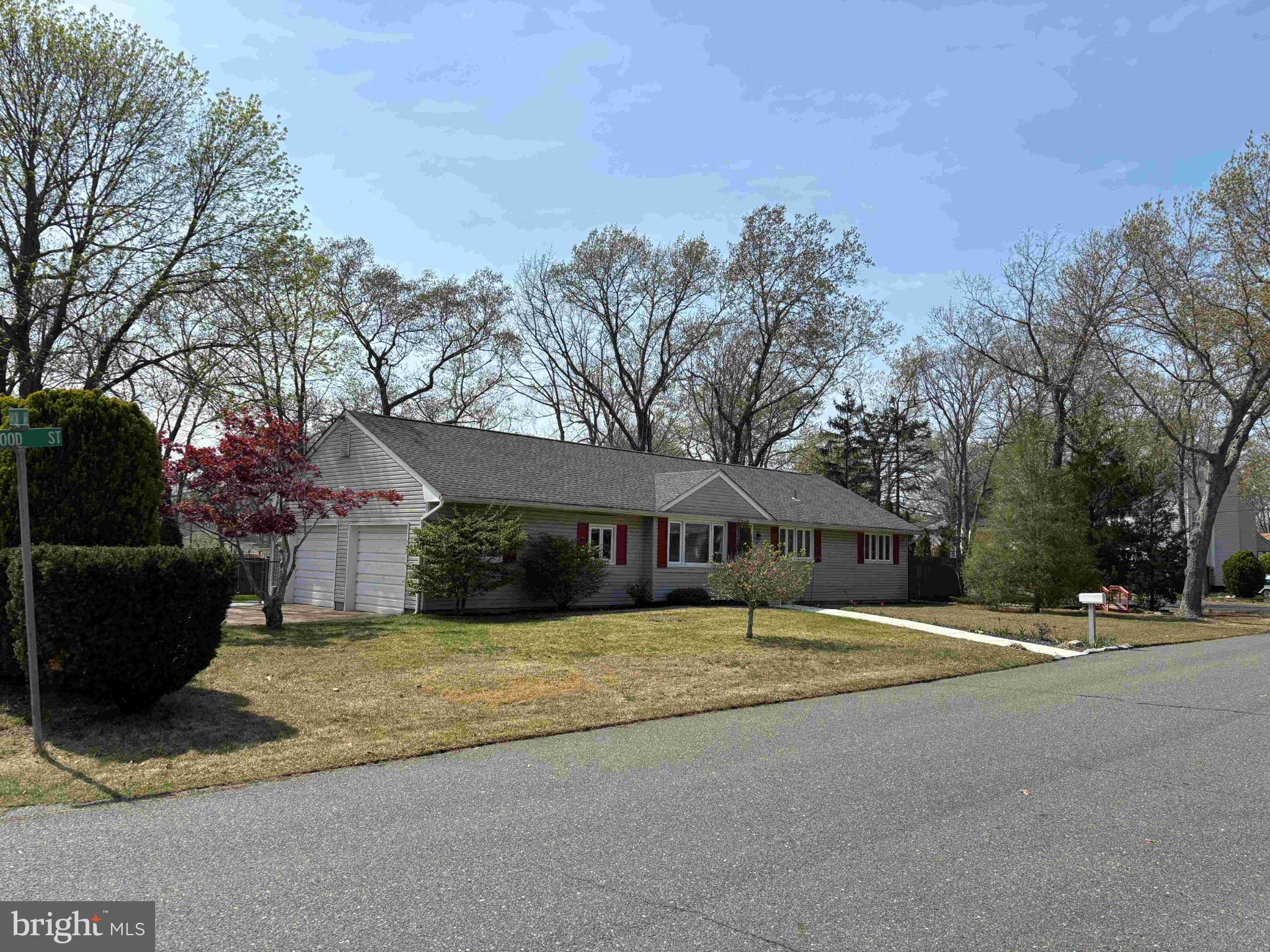 Charming home nestled among lush trees.