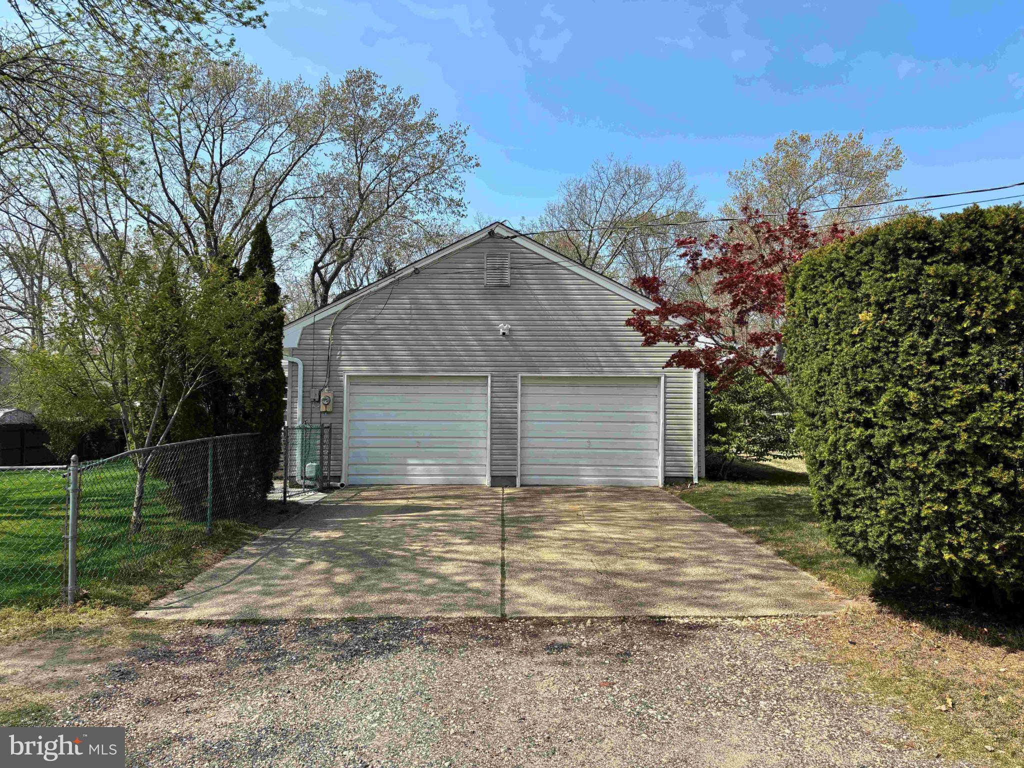 653 Elwood Street Forked River, NJ 08731 - Photo 4 of 33 Charming home with spacious driveway and greenery.