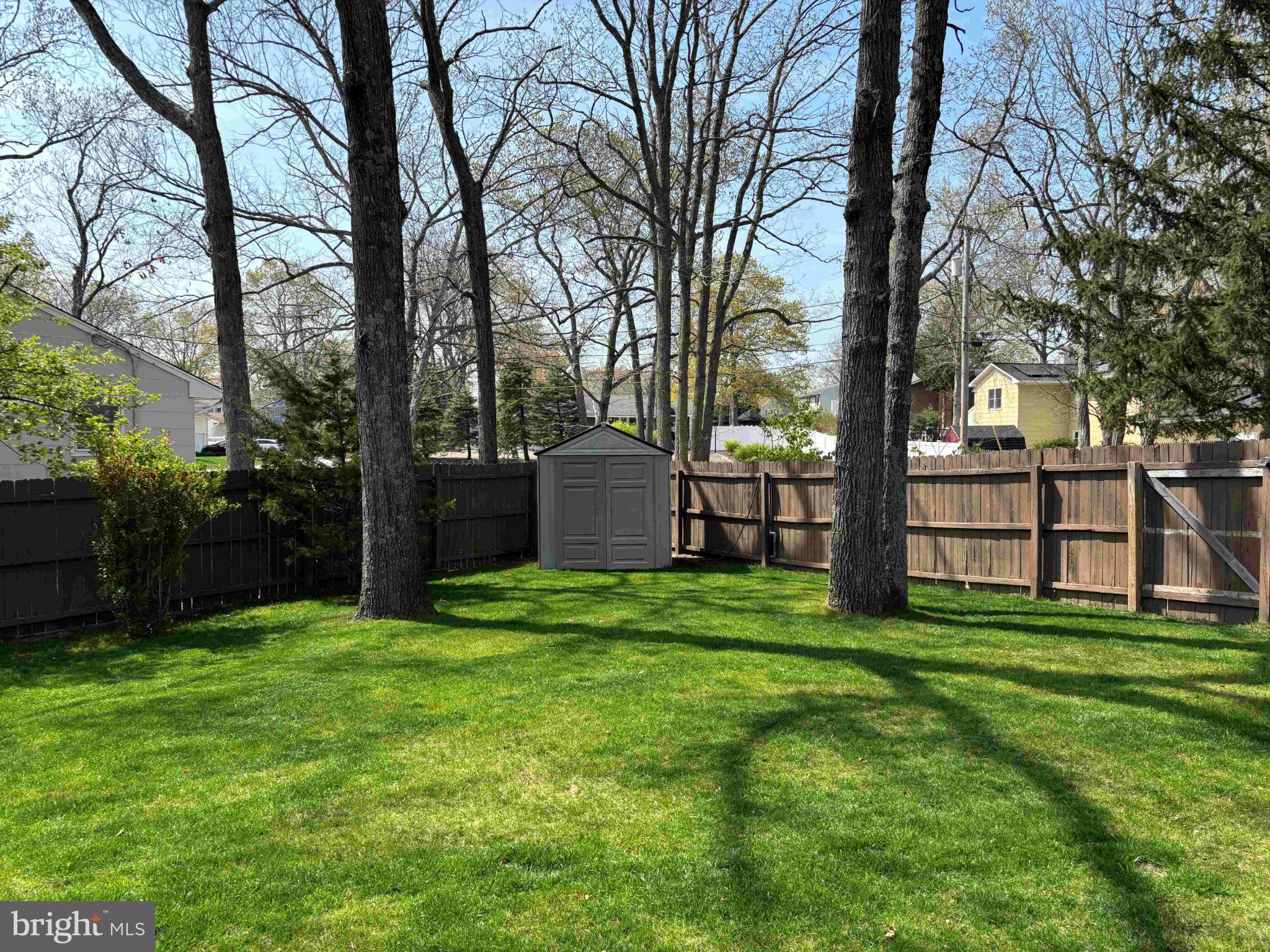 653 Elwood Street Forked River, NJ 08731 - Photo 6 of 33 Serene backyard oasis with lush greenery.
