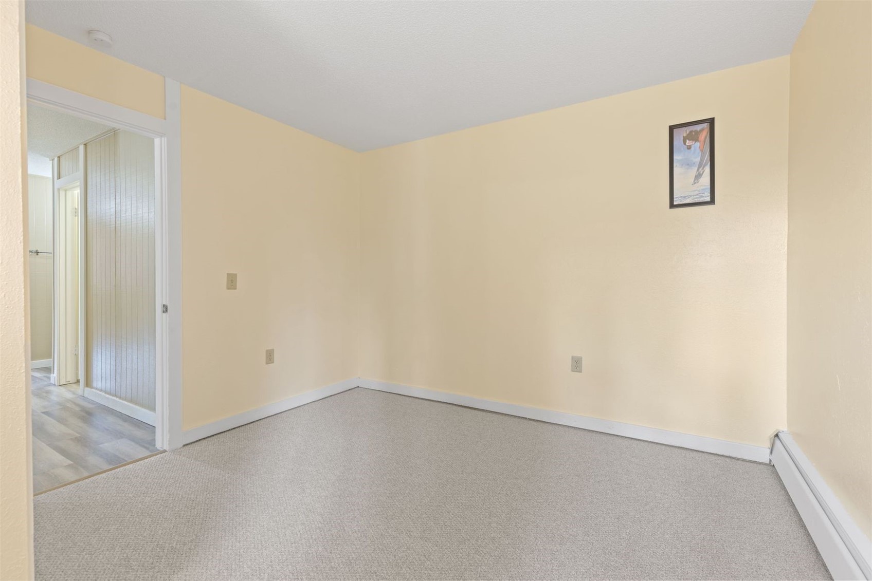 1127 Ski Hill Road, Unit 94 Breckenridge, CO 80424 - Photo 13 of 36 an empty room with a hallway