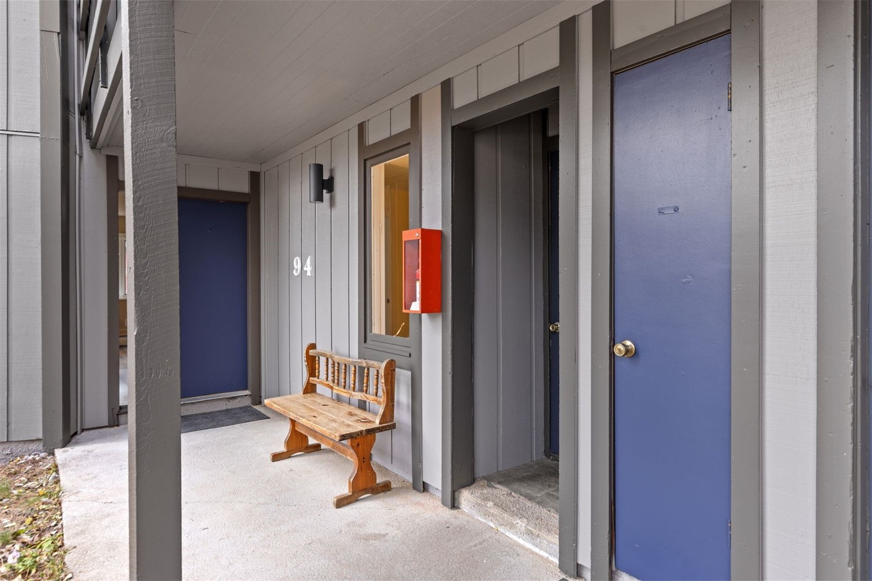1127 Ski Hill Road, Unit 94 Breckenridge, CO 80424 - Photo 24 of 36 a bench in front of a door