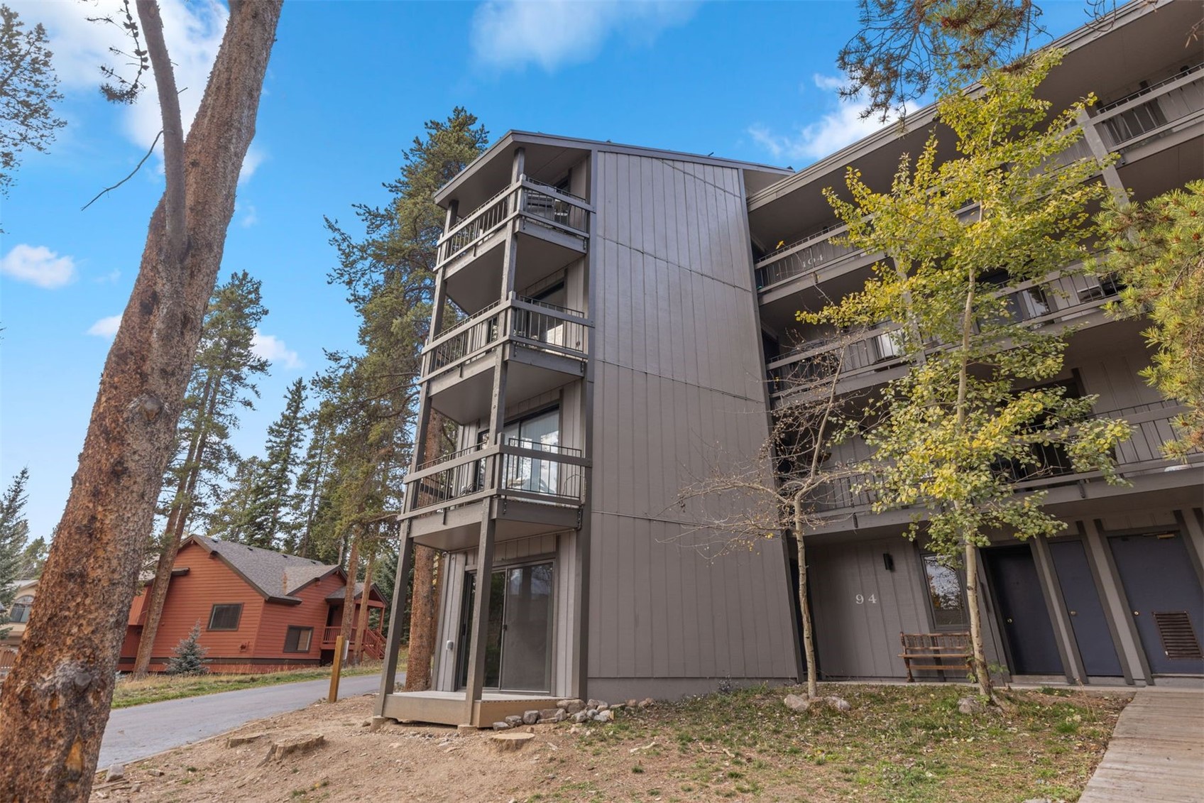 1127 Ski Hill Road, Unit 94 Breckenridge, CO 80424 - Photo 28 of 36 a view of a house with a tree