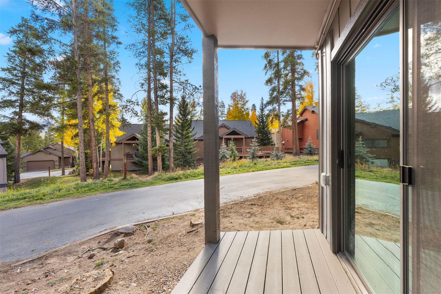 1127 Ski Hill Road, Unit 94 Breckenridge, CO 80424 - Photo 29 of 36 a view of a porch with a yard