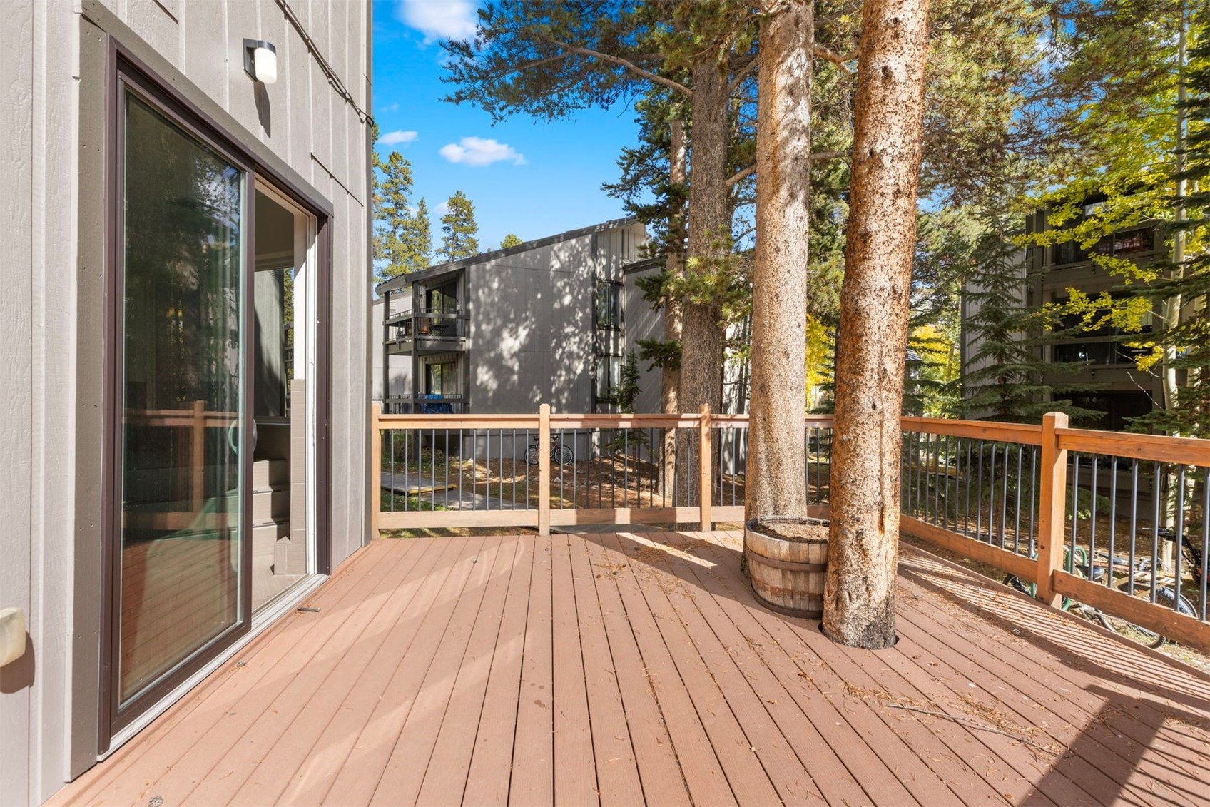 1127 Ski Hill Road, Unit 94 Breckenridge, CO 80424 - Photo 36 of 36 a view of a balcony with wooden floor and fence