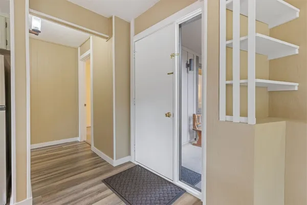 a view of a bathroom with wooden floor and a sink