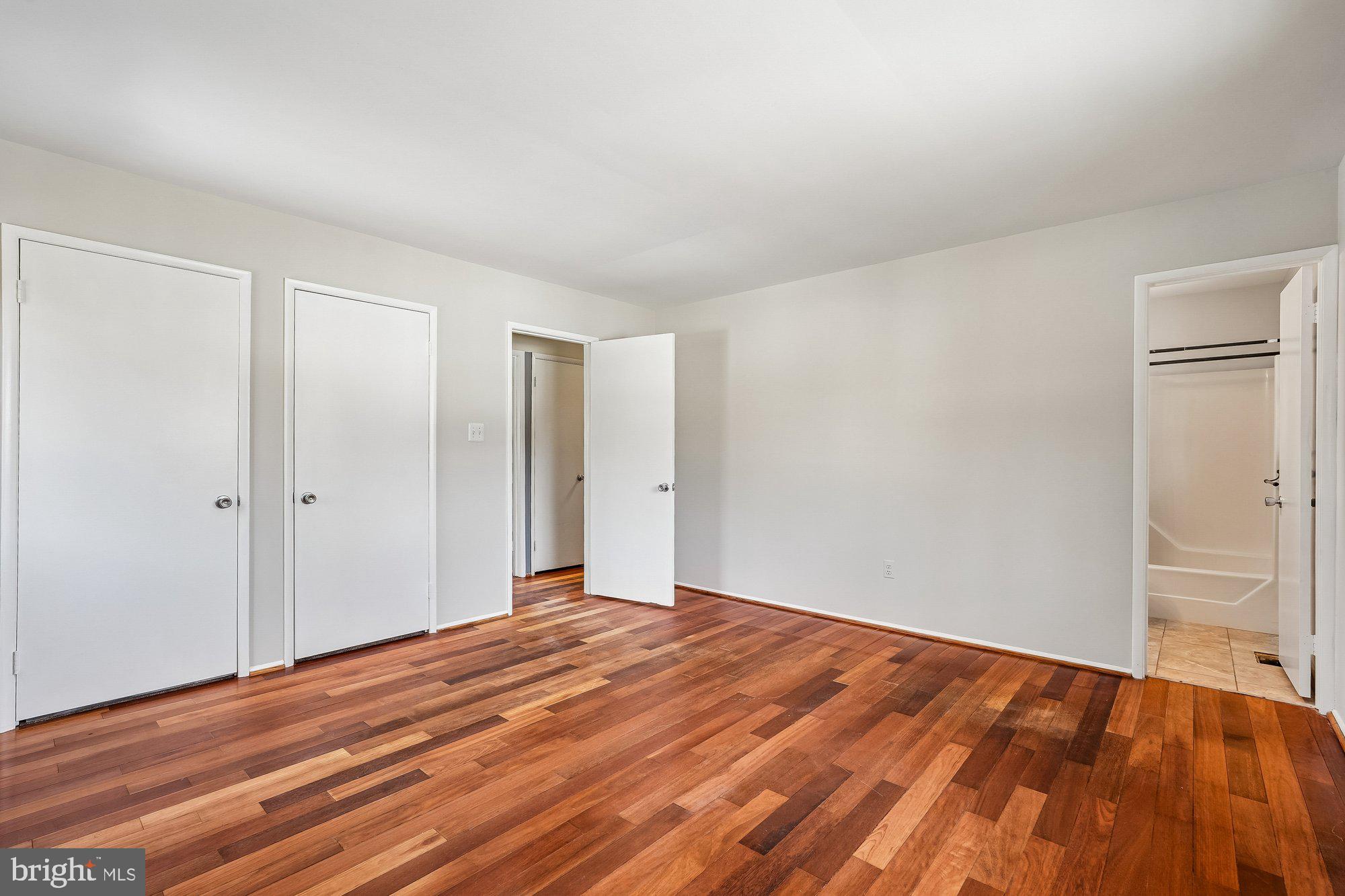 14920 Chestnut Ridge Court North Potomac, MD 20878 - Photo 12 of 32 a view of empty room with wooden floor