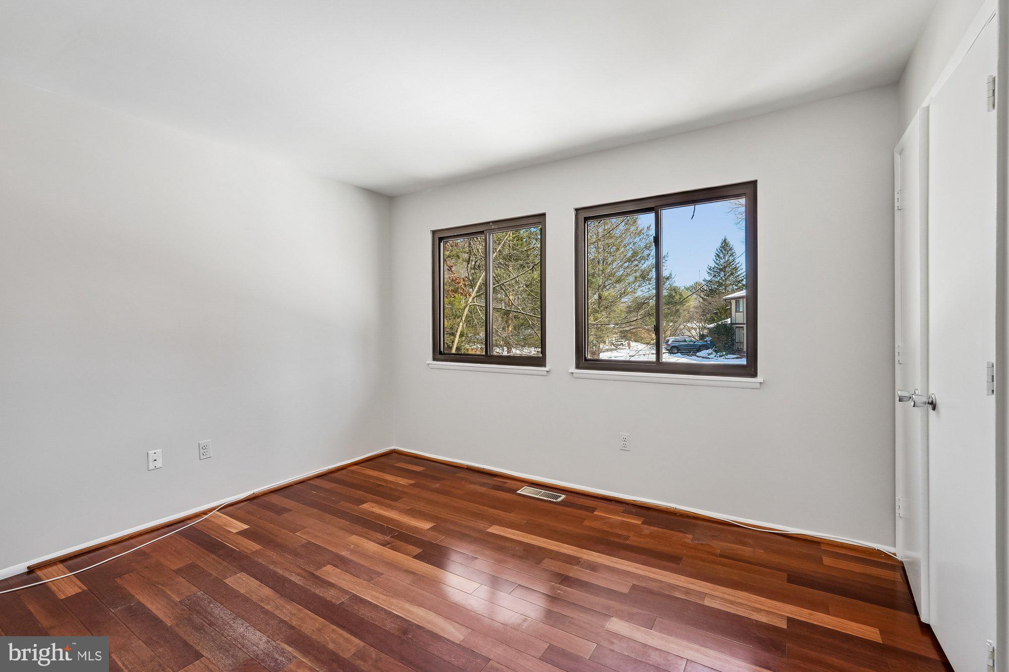 14920 Chestnut Ridge Court North Potomac, MD 20878 - Photo 15 of 32 a view of empty room with wooden floor and fan