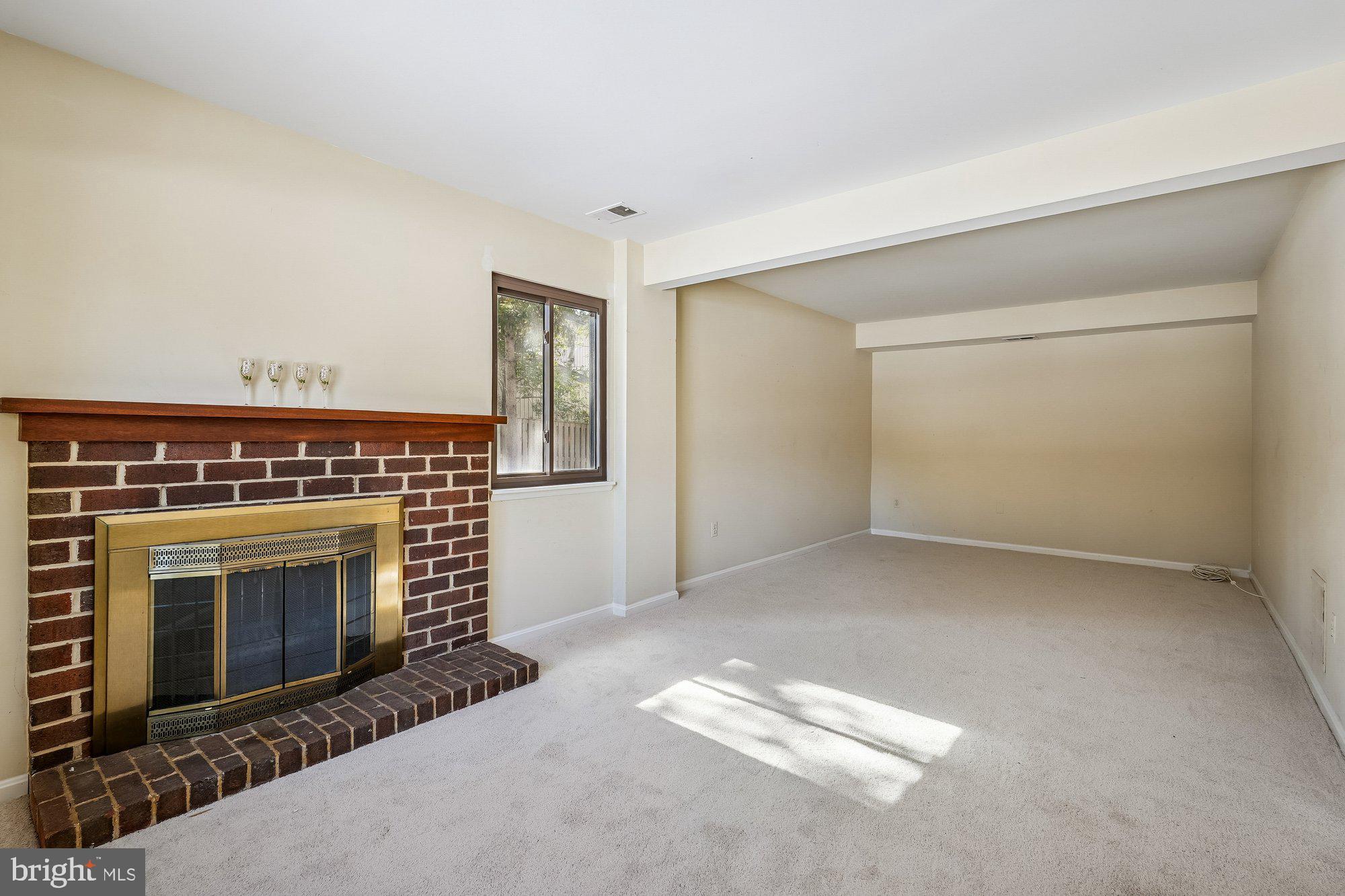 14920 Chestnut Ridge Court North Potomac, MD 20878 - Photo 22 of 32 a view of empty room with fireplace