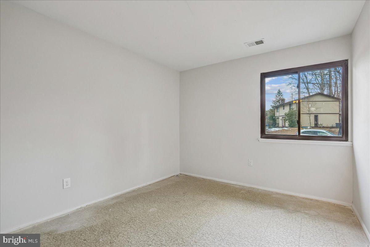 14920 Chestnut Ridge Court North Potomac, MD 20878 - Photo 23 of 32 a view of an empty room with a window