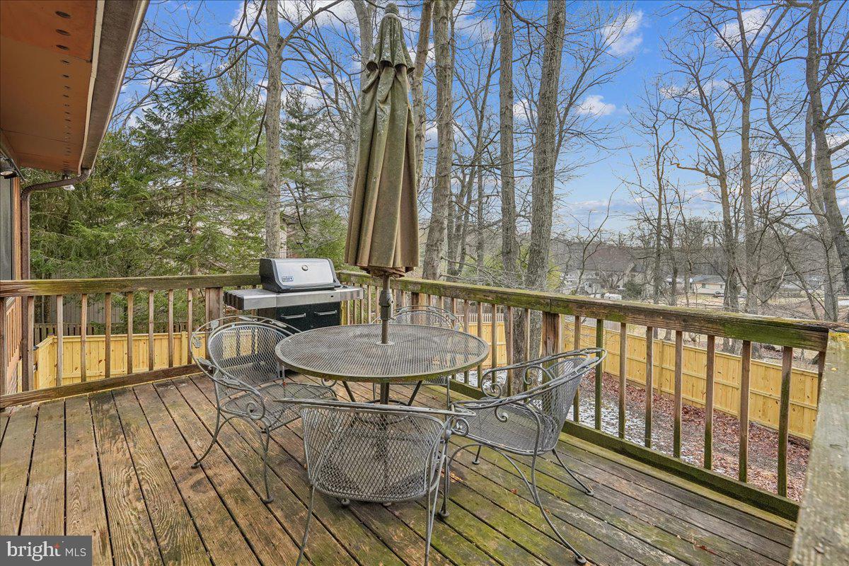 14920 Chestnut Ridge Court North Potomac, MD 20878 - Photo 27 of 32 a view of balcony with furniture and wooden floor