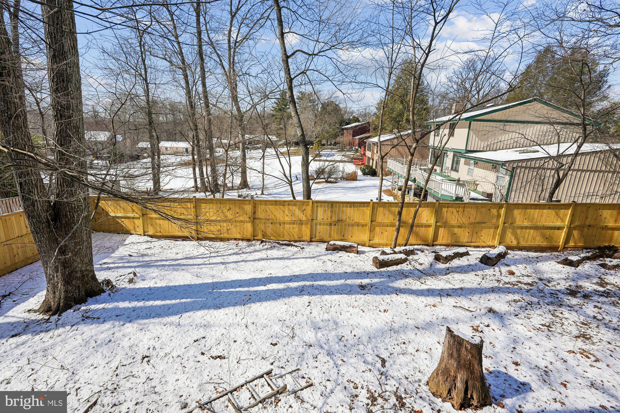 14920 Chestnut Ridge Court North Potomac, MD 20878 - Photo 30 of 32 a view of a swimming pool with a lounge chairs