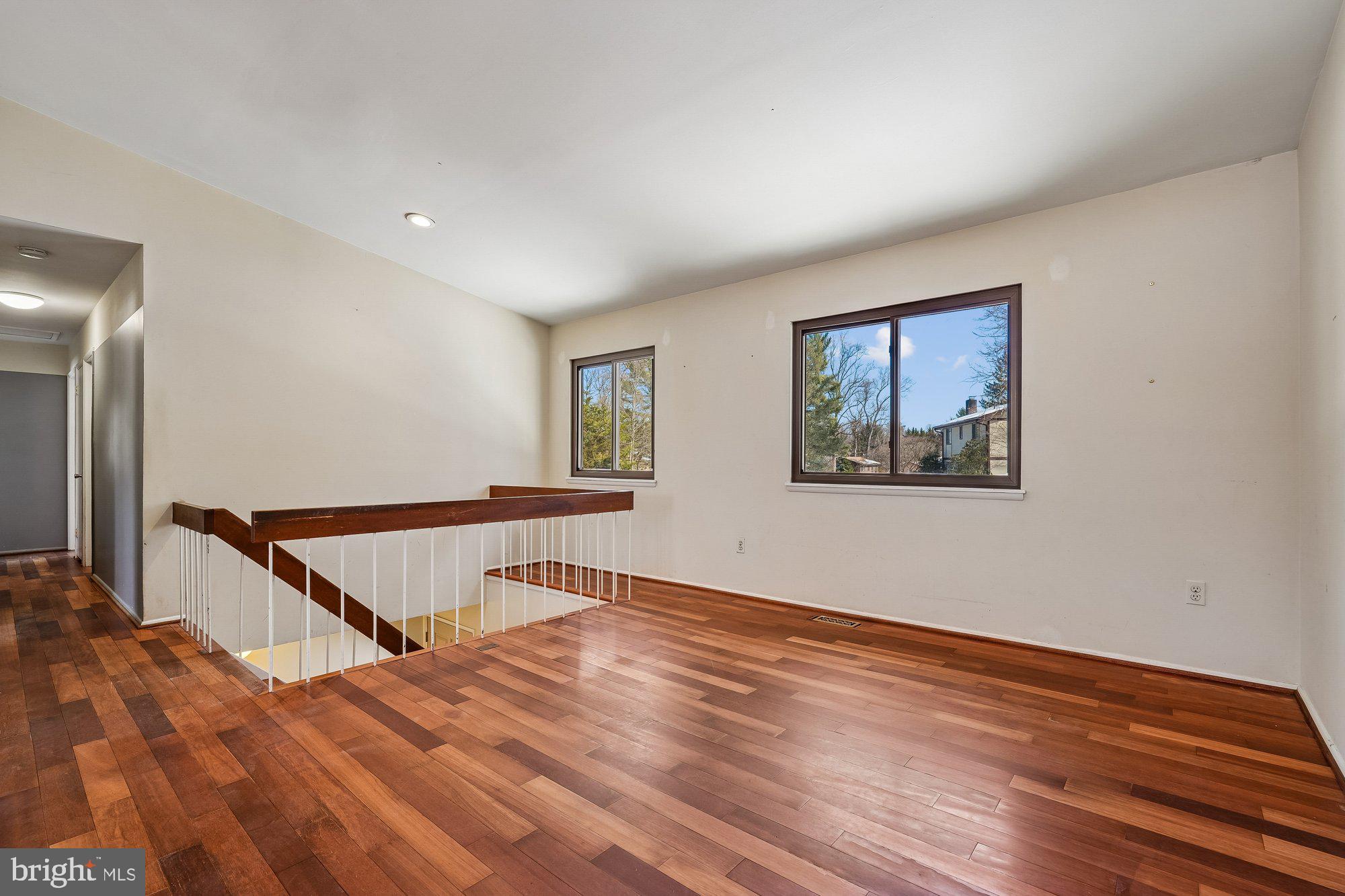 14920 Chestnut Ridge Court North Potomac, MD 20878 - Photo 4 of 32 a view of an empty room with wooden floor