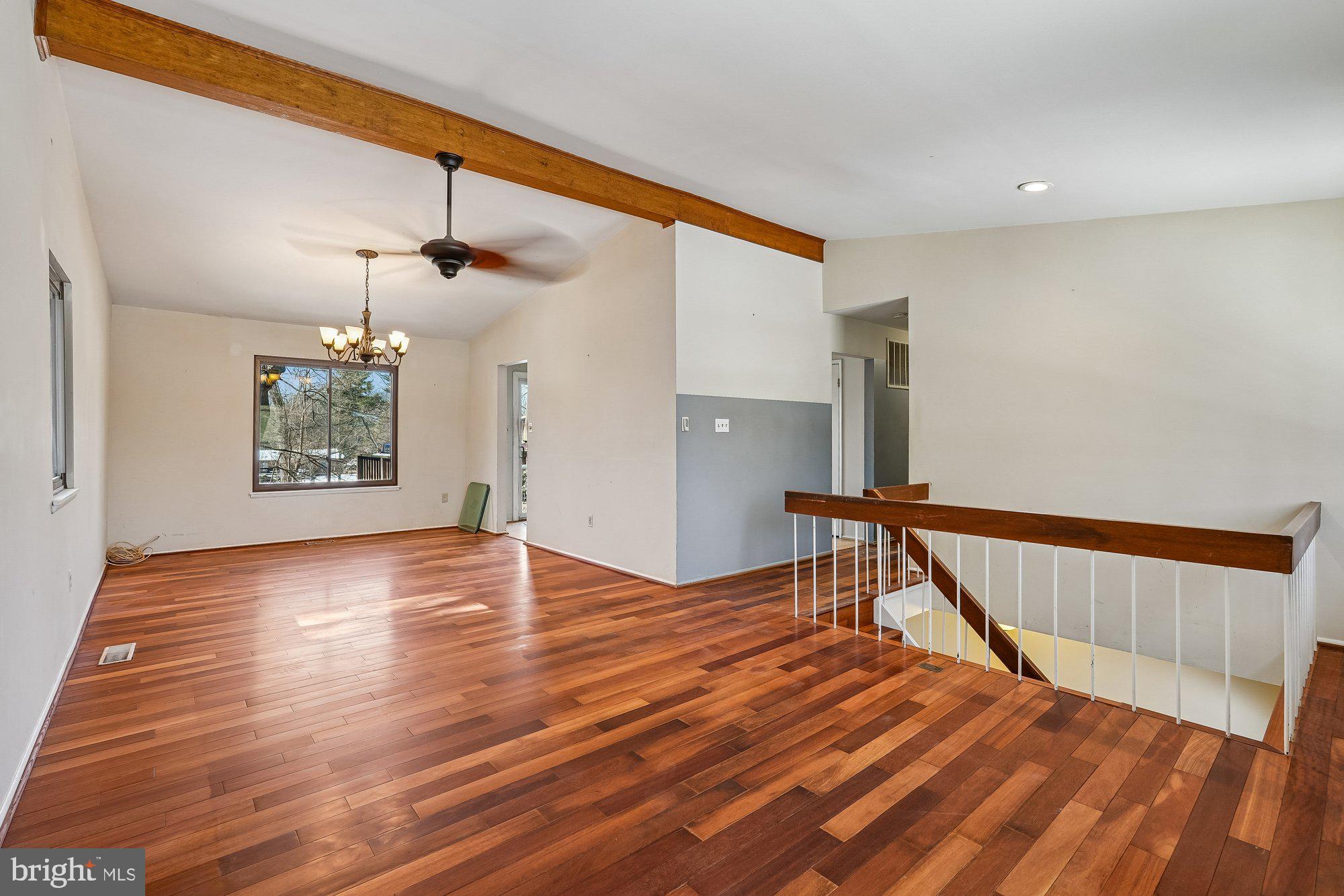 14920 Chestnut Ridge Court North Potomac, MD 20878 - Photo 5 of 32 a view of an empty room with window and wooden floor