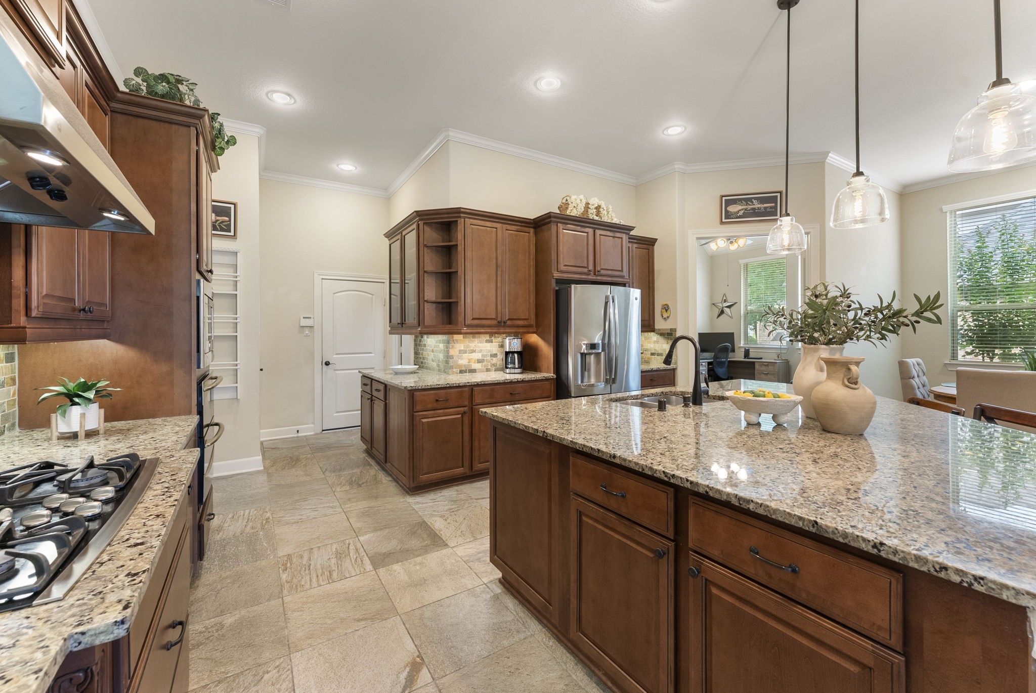 4787 Jackson Square Drive Conroe, TX 77304 - Photo 12 of 35 A kitchen where storage dreams come true! Thoughtfully designed with an abundance of cabinets, drawers, and clever nooks, this space ensures everything has its place—no more cluttered countertops or overflowing shelves. From sleek cabinetry for your dinnerware to deep drawers perfect for pots and pans, every inch has been optimized for functionality and style. Whether you're a culinary enthusiast or just love an organized home, this kitchen is ready to keep up with your lifestyle.