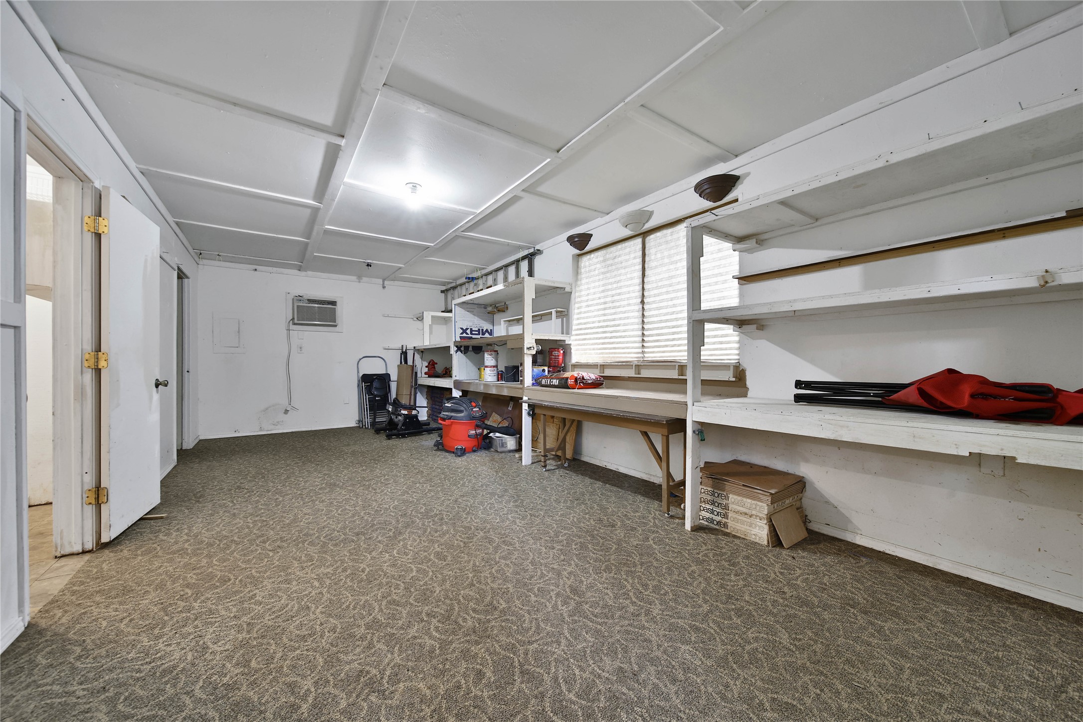 15418 Willis Way Conroe, TX 77384 - Photo 41 of 41 Back half of the garage, endless possibilities for this space. It was the previous living quarters while the home was finished so it's plumbed for sinks, shower and toilet.