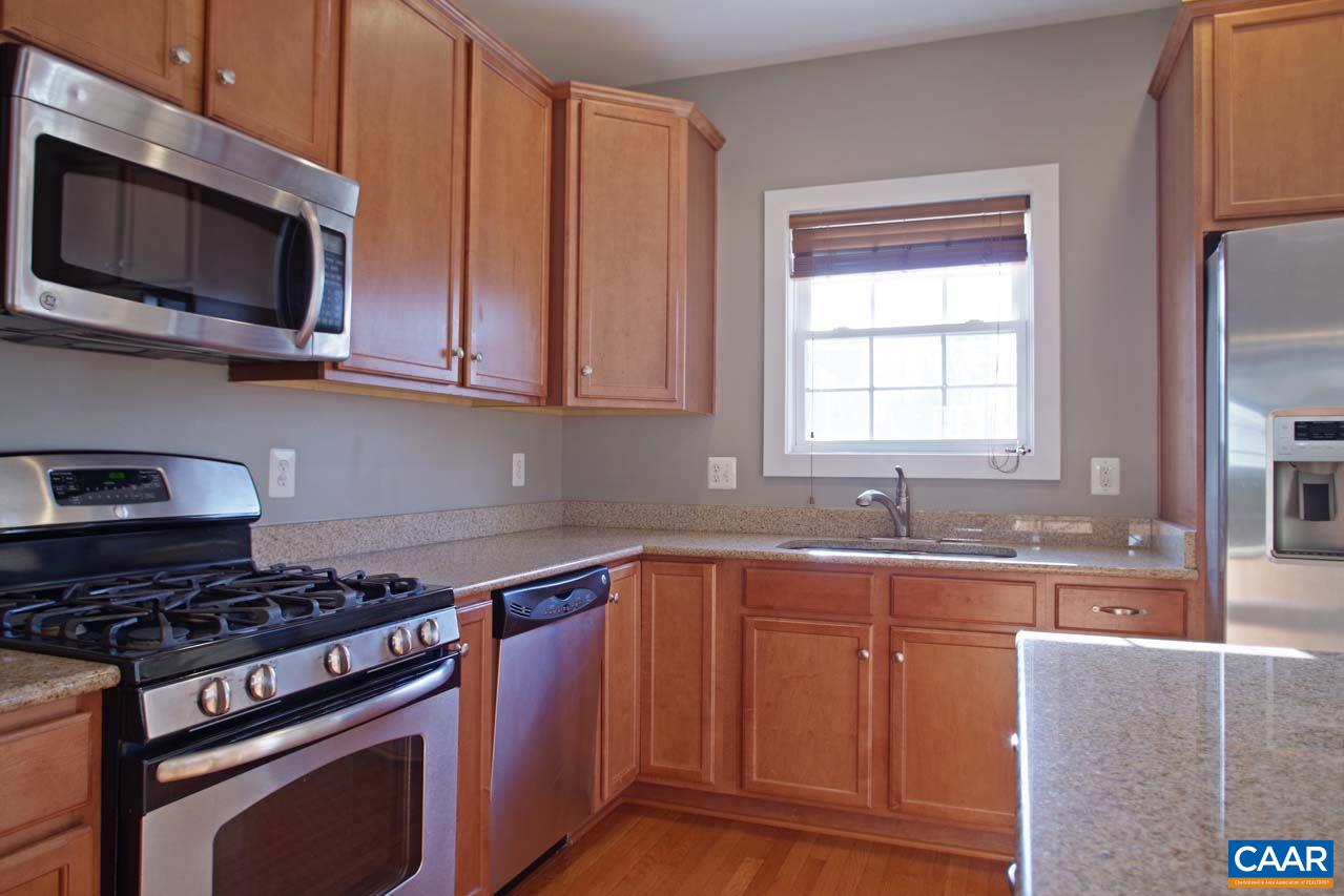 5477 Park Road Crozet, VA 22932 - Photo 11 of 47 a kitchen with stainless steel appliances granite countertop a stove a sink and a microwave