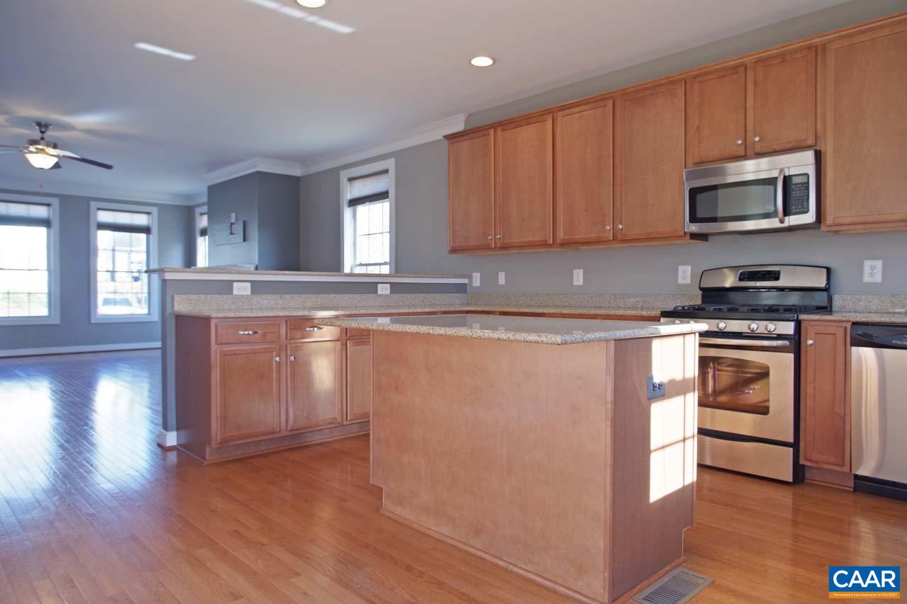 5477 Park Road Crozet, VA 22932 - Photo 13 of 47 a kitchen with stainless steel appliances granite countertop a stove a sink and a microwave