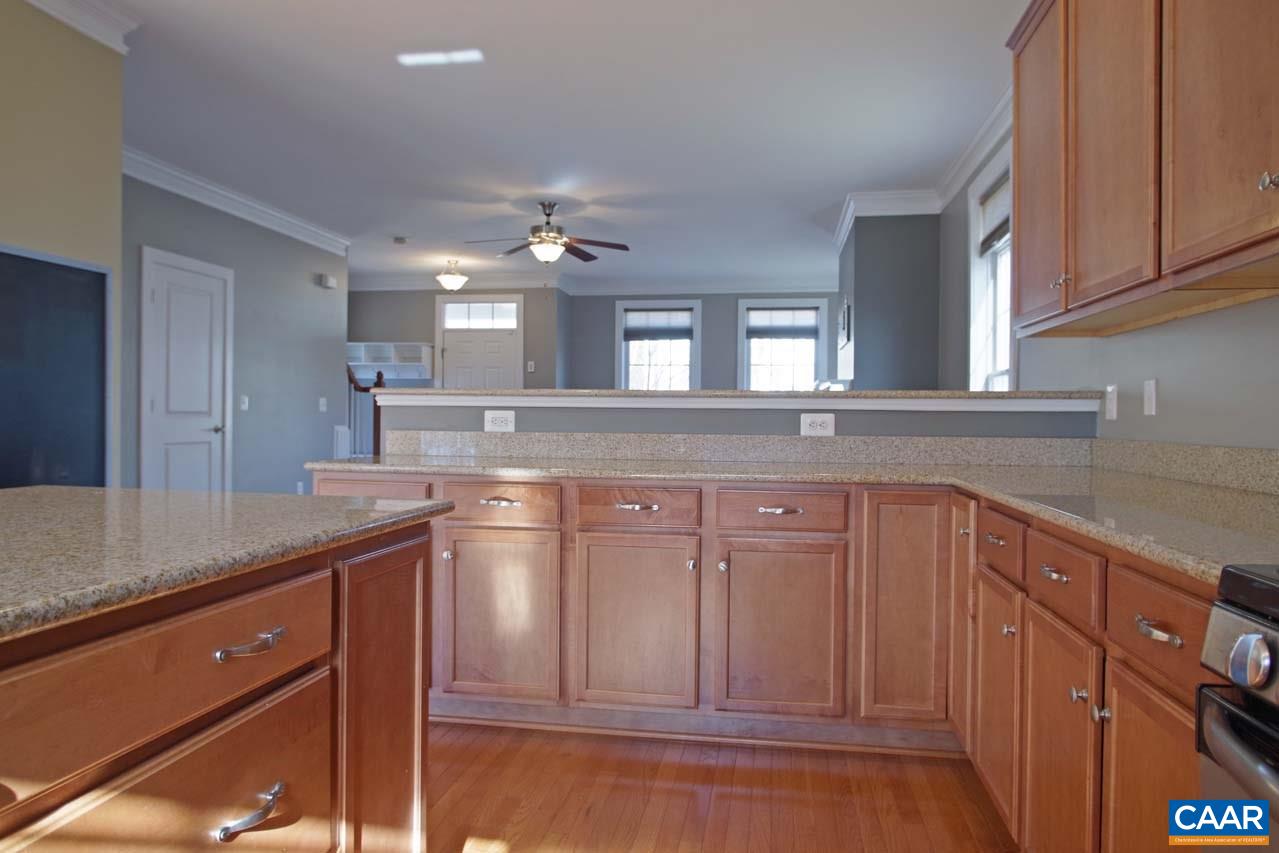 5477 Park Road Crozet, VA 22932 - Photo 14 of 47 a kitchen with kitchen island granite countertop a sink cabinets and stainless steel appliances
