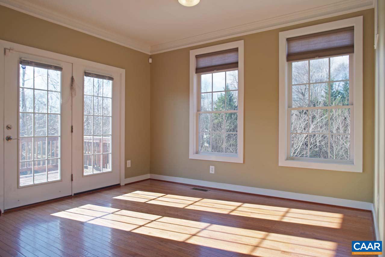 5477 Park Road Crozet, VA 22932 - Photo 16 of 47 a view of an empty room with wooden floor and a window