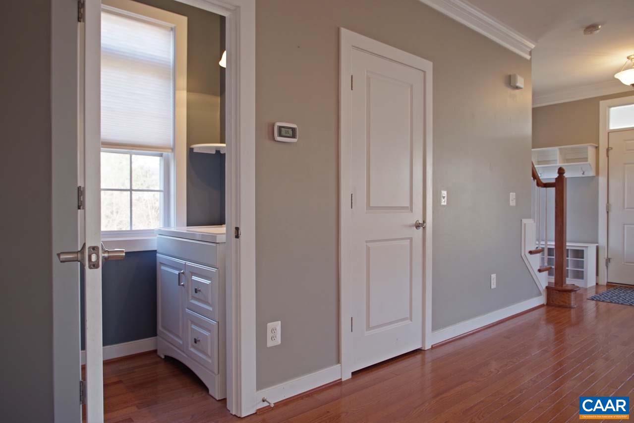 5477 Park Road Crozet, VA 22932 - Photo 19 of 47 a view of a hallway with wooden floor and cabinet