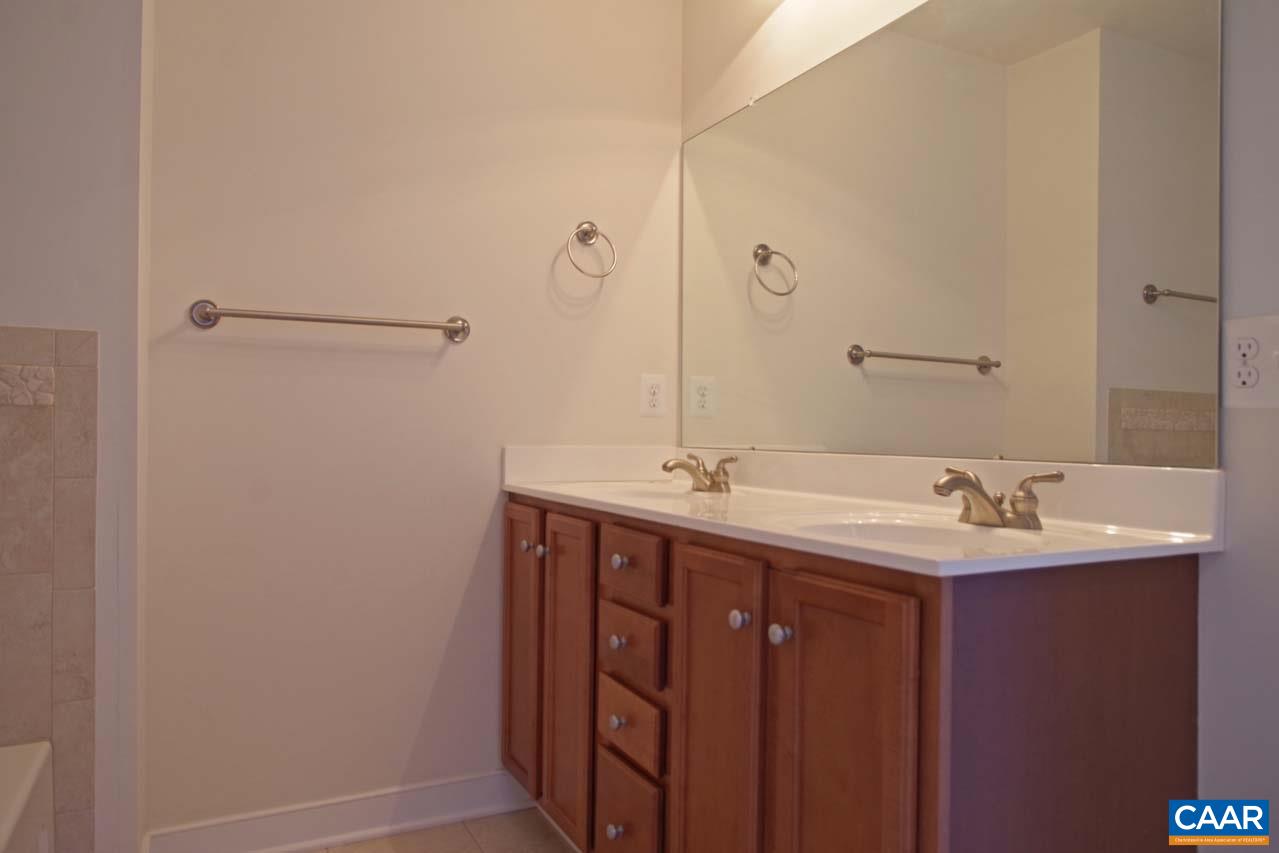 5477 Park Road Crozet, VA 22932 - Photo 26 of 47 a bathroom with a double vanity sink and mirror