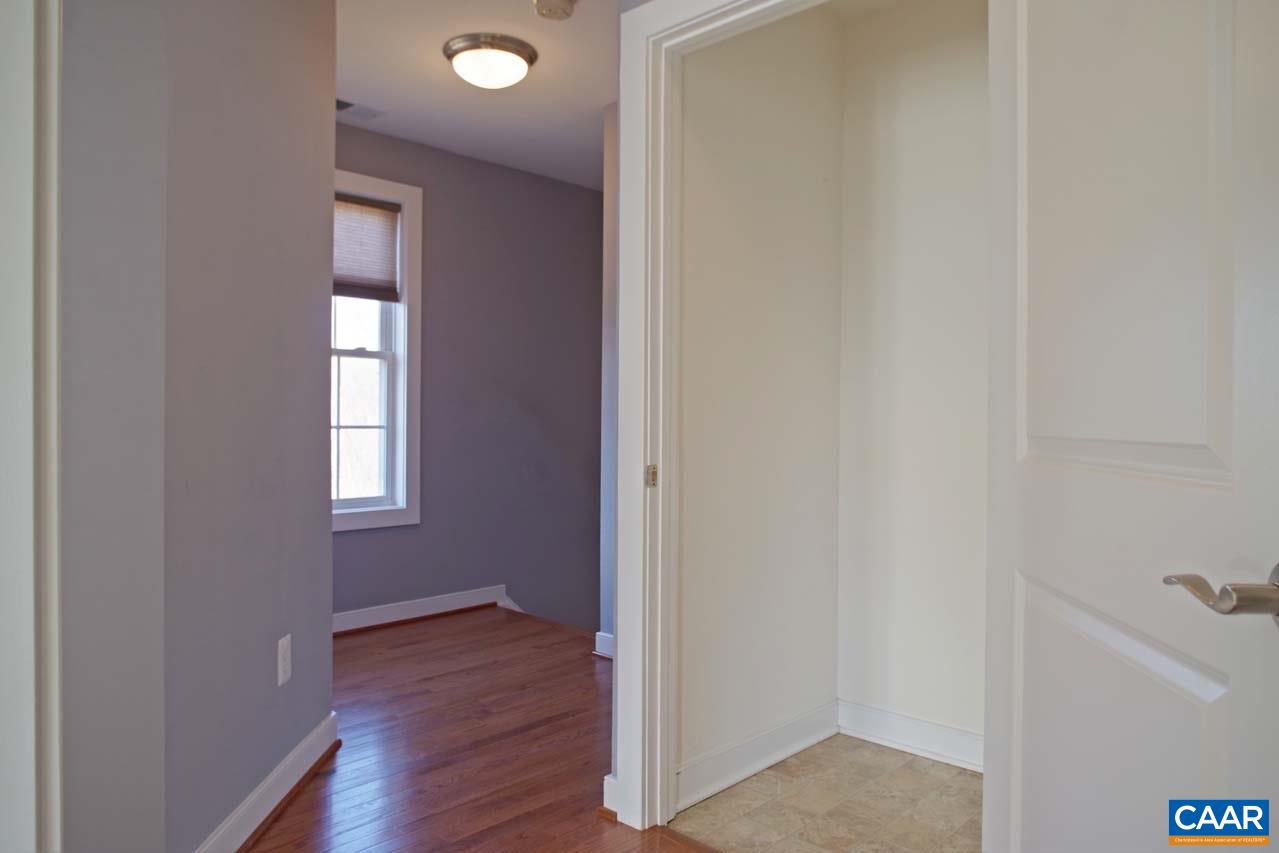 5477 Park Road Crozet, VA 22932 - Photo 30 of 47 a view of an empty room with wooden floor and a window